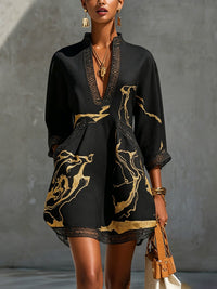 Donatella | Mini dress in black with golden marble print and crochet lace Hero